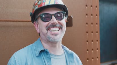 Joel L., a utility operator, laughs during an interview about his job at High Steel Structures.